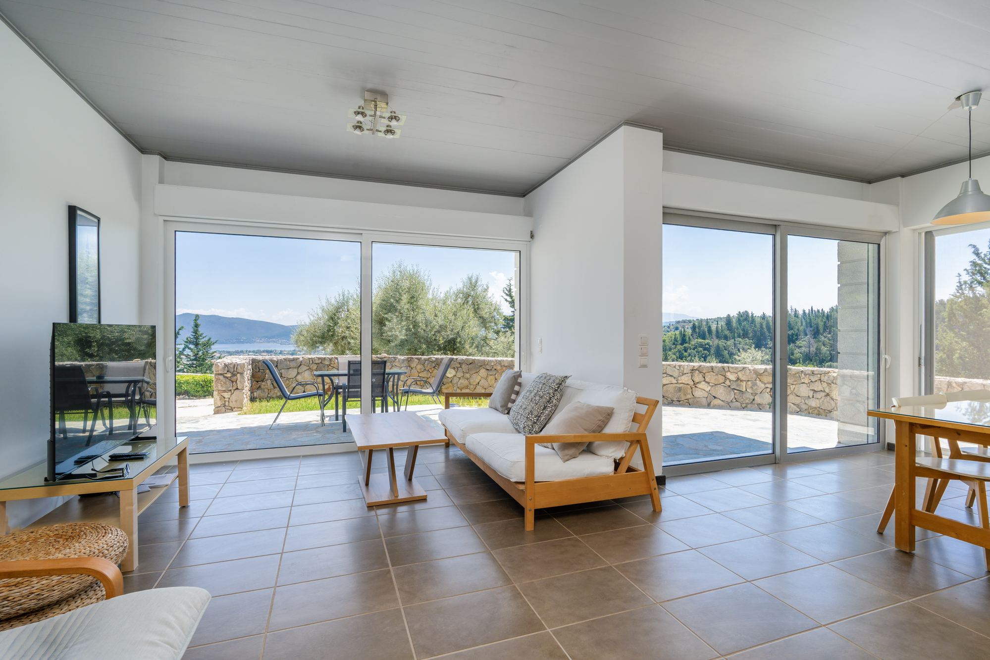 Bright open-plan living room with sea view